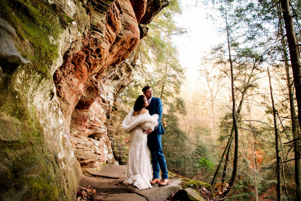 The Rockhouse, with its tunnel-like cave and captivating 'window' views, provided a truly unique and breathtaking backdrop for their intimate Couples Portraits.