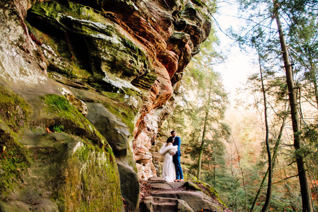 The Rockhouse, with its tunnel-like cave and captivating 'window' views, provided a truly unique and breathtaking backdrop for their intimate Couples Portraits.