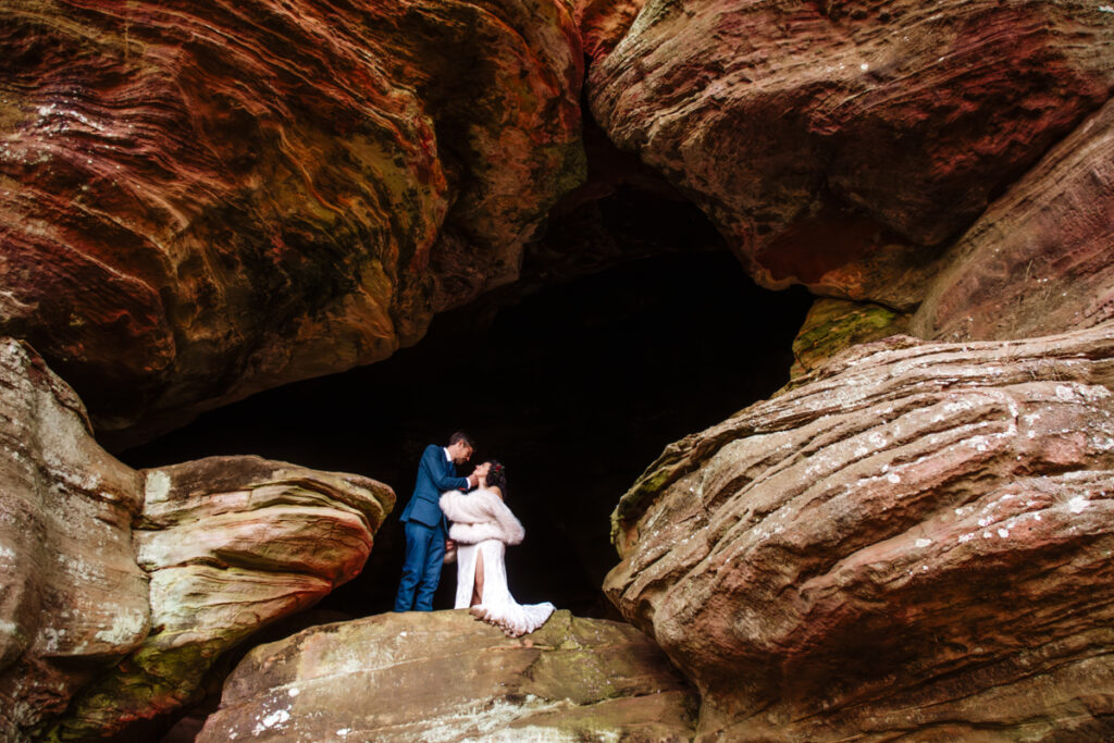 The Rockhouse, with its tunnel-like cave and captivating 'window' views, provided a truly unique and breathtaking backdrop for their intimate Couples Portraits.