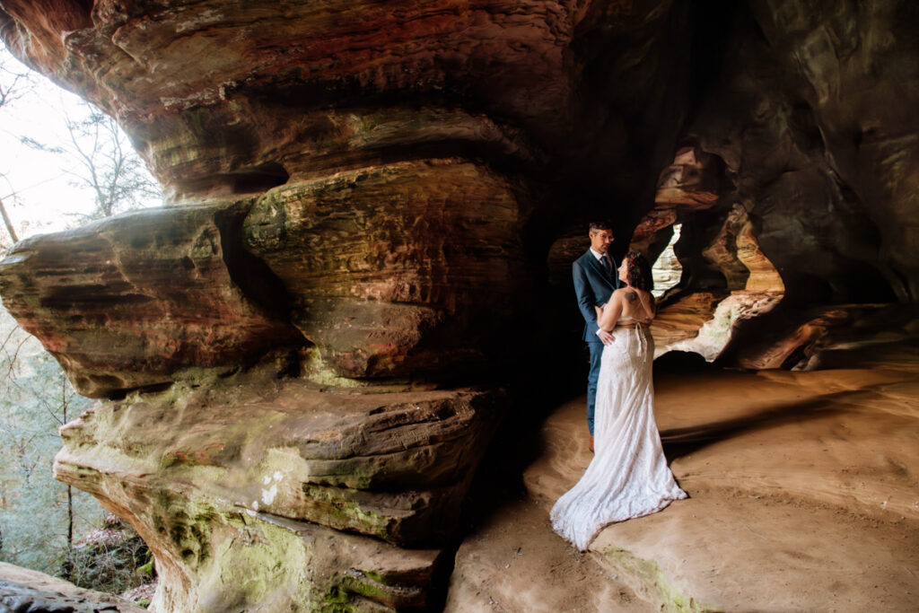 The Rockhouse, with its tunnel-like cave and captivating 'window' views, provided a truly unique and breathtaking backdrop for their intimate Couples Portraits.