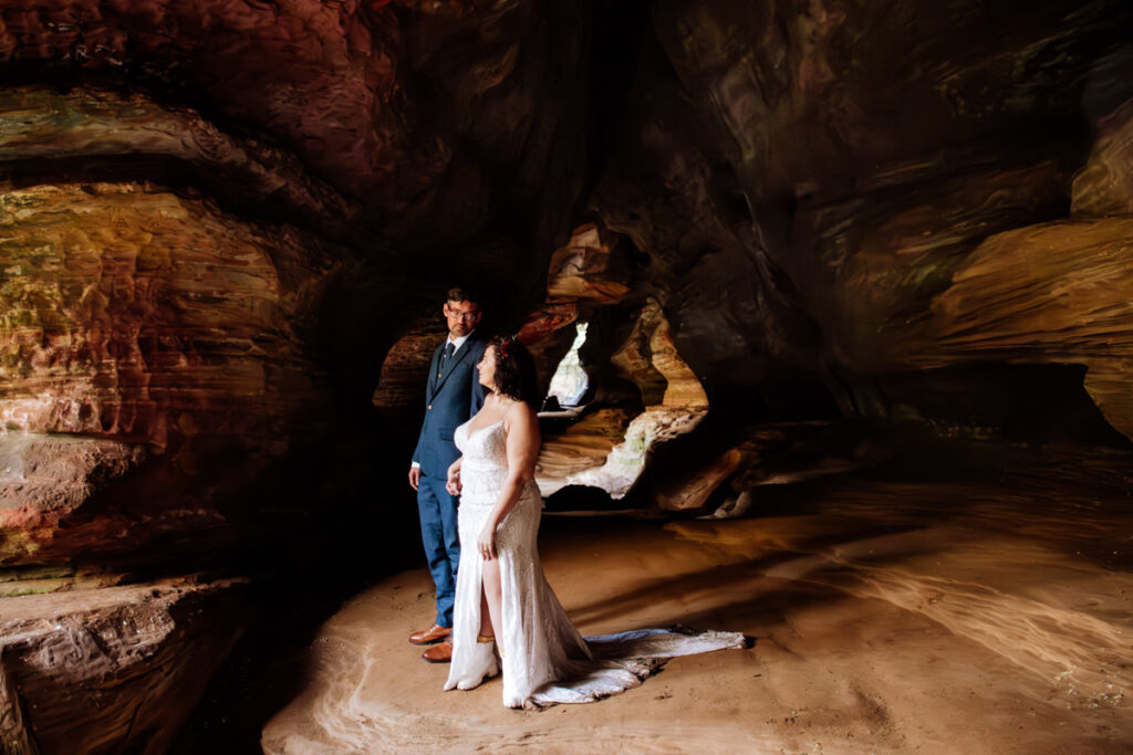 The Rockhouse, with its tunnel-like cave and captivating 'window' views, provided a truly unique and breathtaking backdrop for their intimate Couples Portraits.