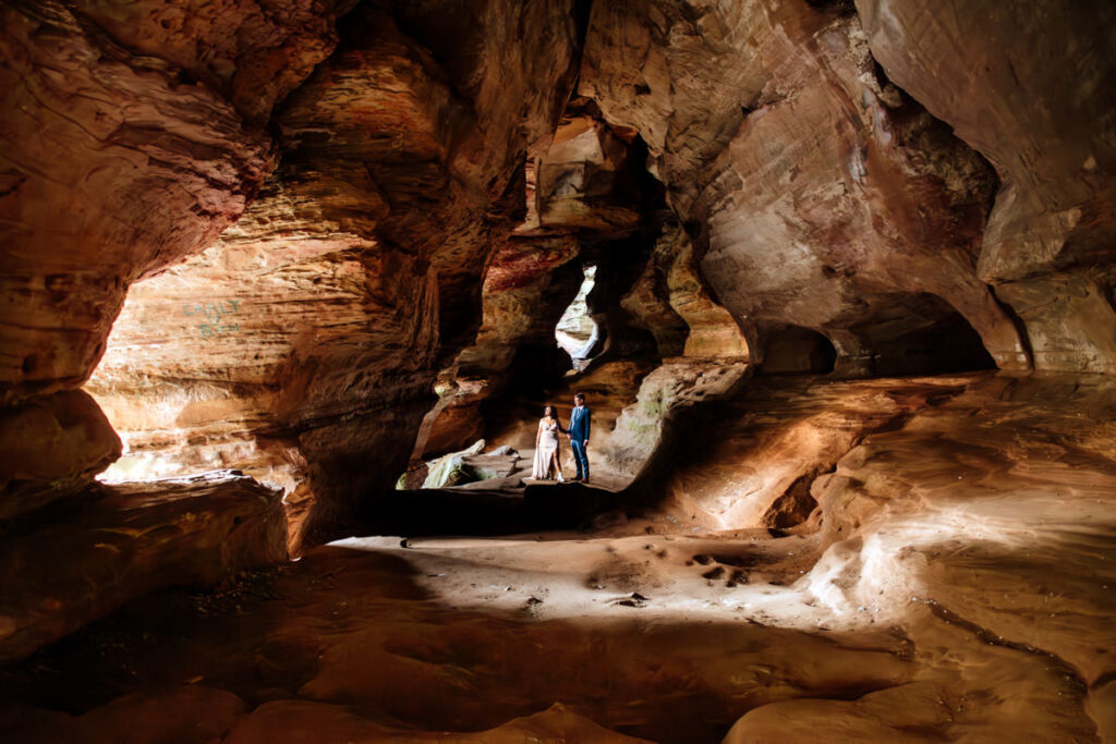 The Rockhouse, with its tunnel-like cave and captivating 'window' views, provided a truly unique and breathtaking backdrop for their intimate Couples Portraits.