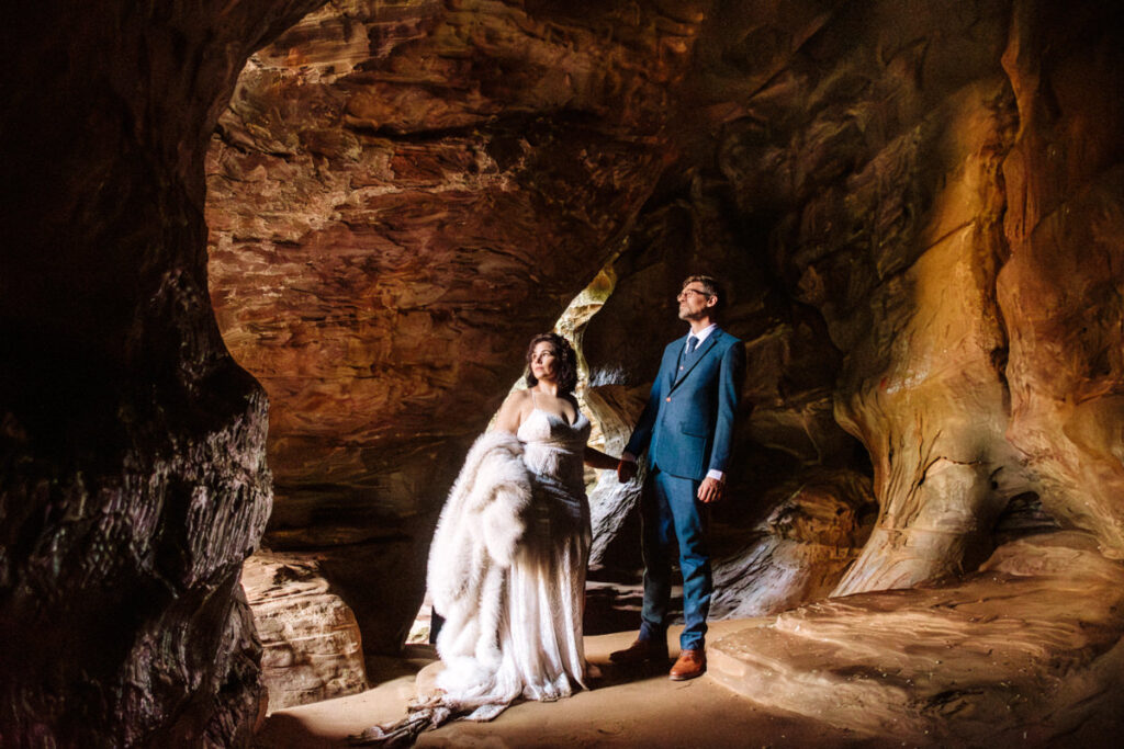 The Rockhouse, with its tunnel-like cave and captivating 'window' views, provided a truly unique and breathtaking backdrop for their intimate Couples Portraits.