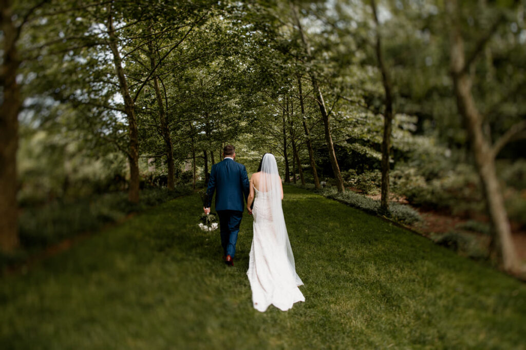 To ensure a truly memorable and photogenic ceremony, consider these key tips: prioritize soft, flattering light by planning your ceremony during golden hour, while also being mindful of your guests' comfort and avoiding direct sunlight in their eyes. During the processional, savor the moment and take in your surroundings, rather than rushing. For guest positioning, a V-shape, cluster, line, or circle arrangement can create beautiful visuals and enhance intimacy. When exchanging rings, do so deliberately, tilting your hands for optimal viewing and pausing to admire the rings. Encourage your officiant to step aside during vows and the first kiss, allowing for unobstructed photographs. Maintain eye contact with each other, the officiant, and your guests throughout the ceremony, capturing genuine emotions. After the official announcement, celebrate freely and authentically, expressing your joy through movement and affection. Finally, during the recessional, seize the opportunity for another kiss or a playful dip, culminating in a joyful and memorable exit.