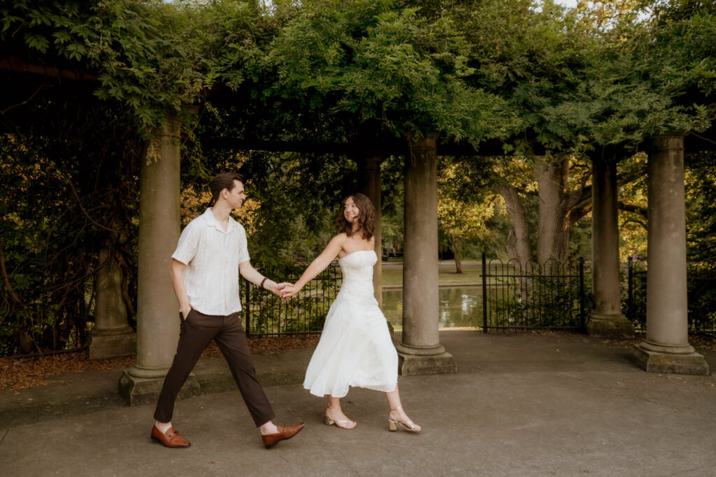 Schiller Park Columbus Ohio Engagement Photos Elizabeth Nihiser Photography Romantic Comedy Central Park Cute Whimsical Fun Love Joy Happy Beautiful Artistic Film Motion Blur Classic Modern Golden Hour Dress Outfit Inspo Inspiration Pinterest Travel Best Ring