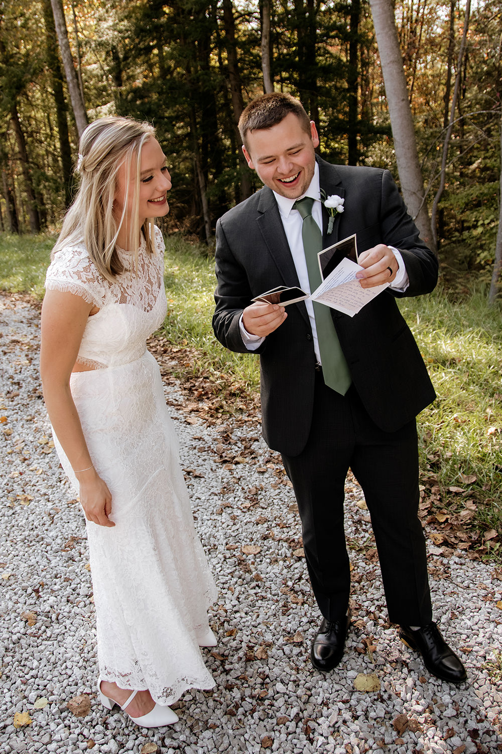Bride and groom standing together at Hocking Hills Lodge during their October wedding. The scene includes warm autumn colors and forest elements.