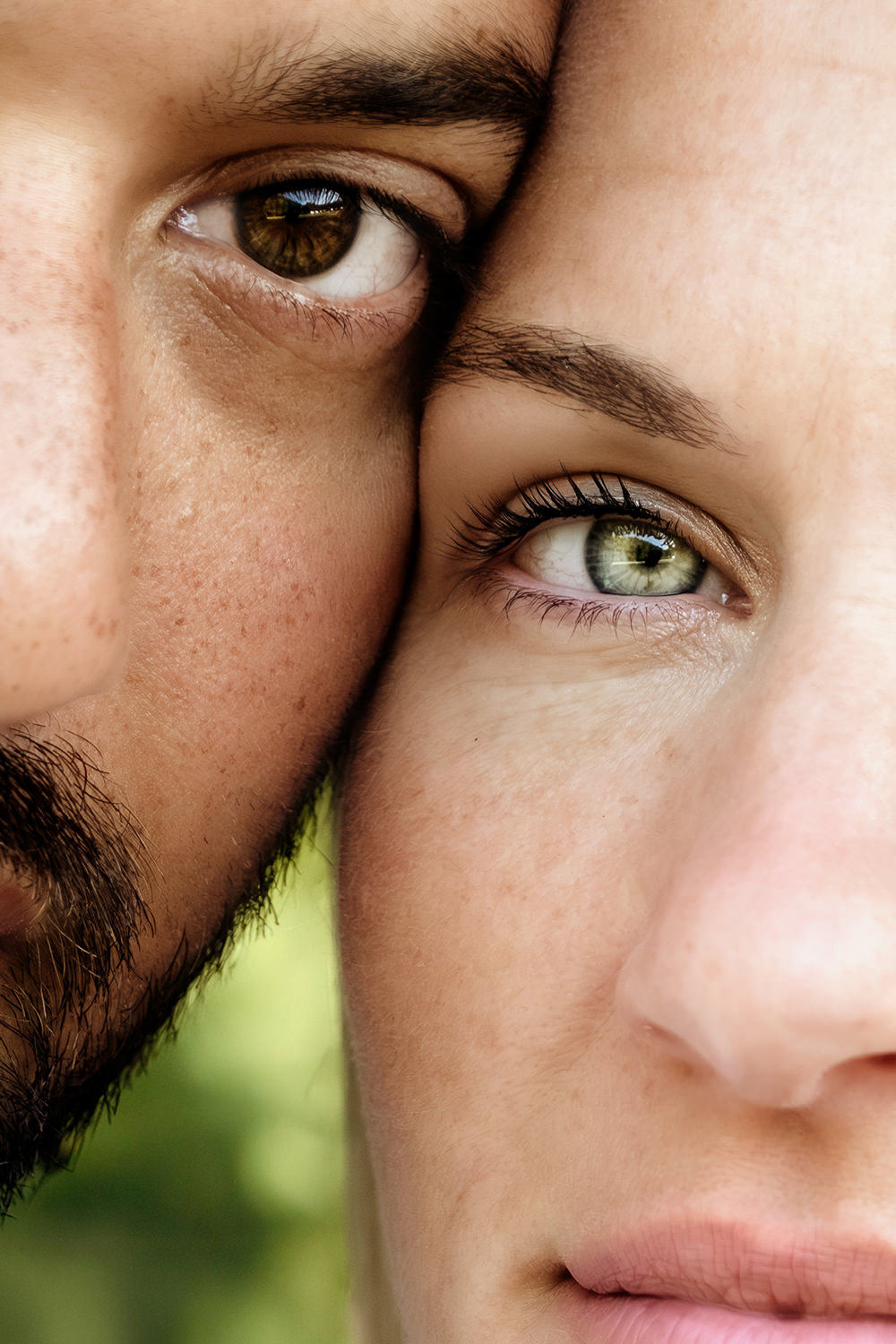 Close up photo of a Filipino man with brown hair, beard, and eyes touching his face to his wife's face.  She has blonde hair and pale green jade eyes.  The photos was taken at sunrise in Conkles Hollow Gorge Hocking Hills, Ohio.
