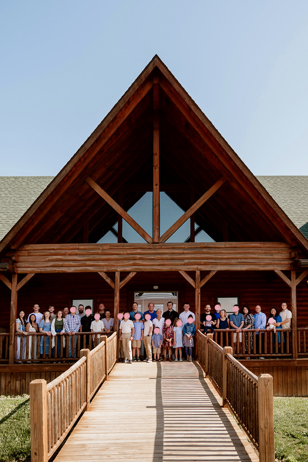 Extended family portrait with 24 grandchildren on porch of Sunset Lodge in the Hocking Hills.