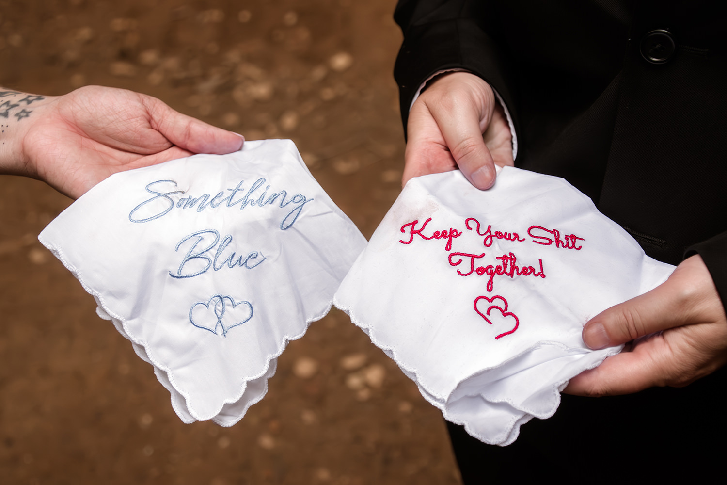 Two brides hold up handkerchiefs. One says, " something blue." the other says "keep your shit together."