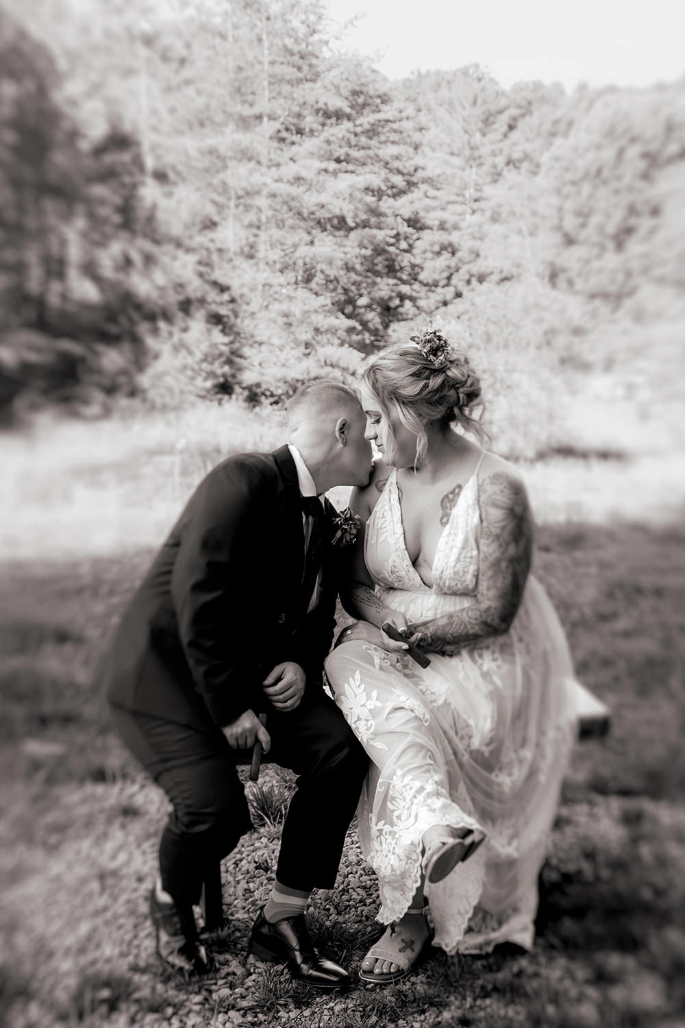 Black and white photo of two brides getting ready for their vow renewal.