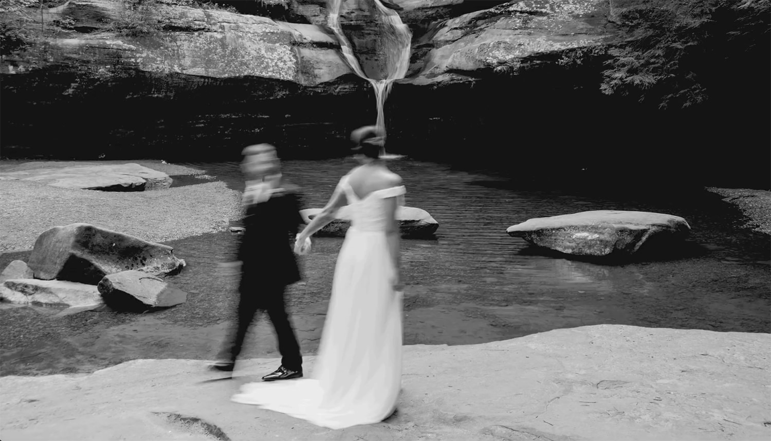 Screenshot of a Youtube video of a black and white gif created by layering elopement and waterfall photos together.  The location is Cedar Falls in the Hocking Hills. 
