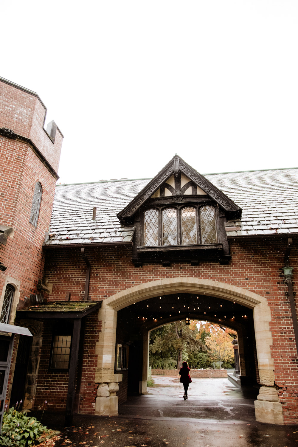 ainy day wedding portrait at Stan Hywet Hall and Gardens Carriage House.