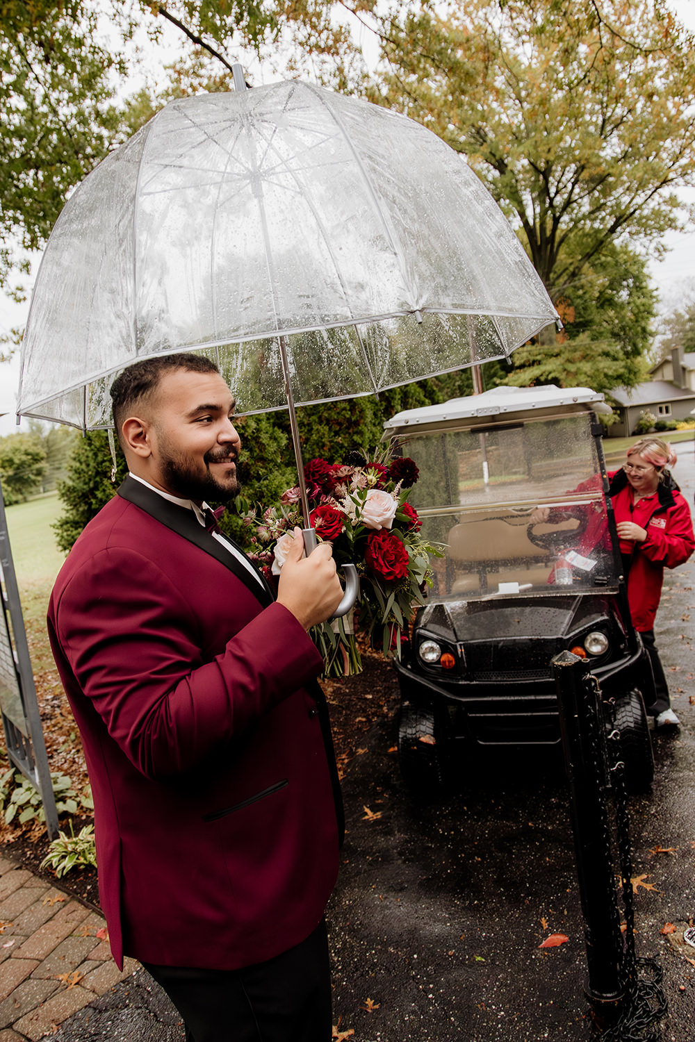 Rainy day wedding portrait at Stan Hywet Hall and Gardens Conservatory in the English Garden.