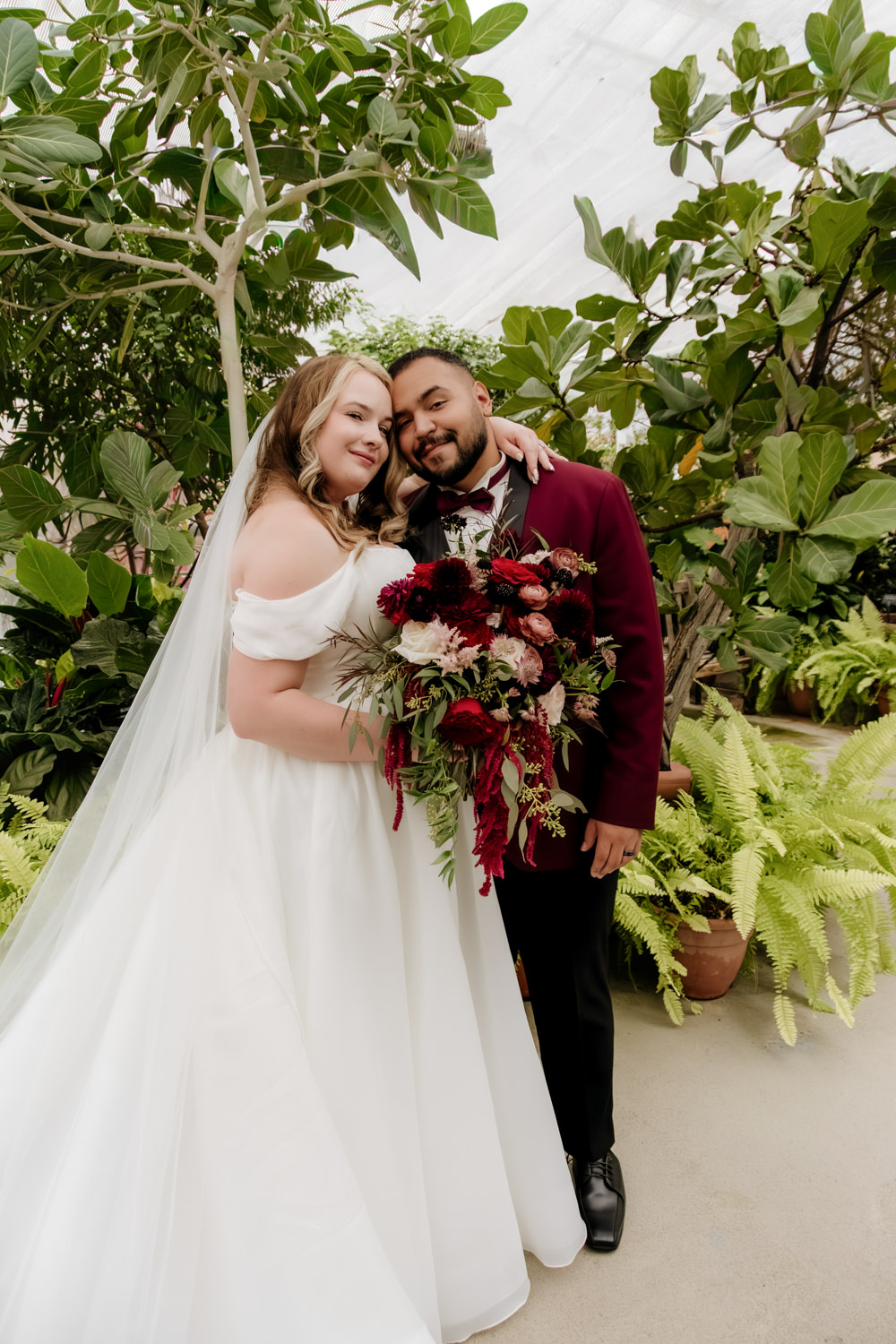 Rainy day wedding portrait at Stan Hywet Hall and Gardens Conservatory in the English Garden.