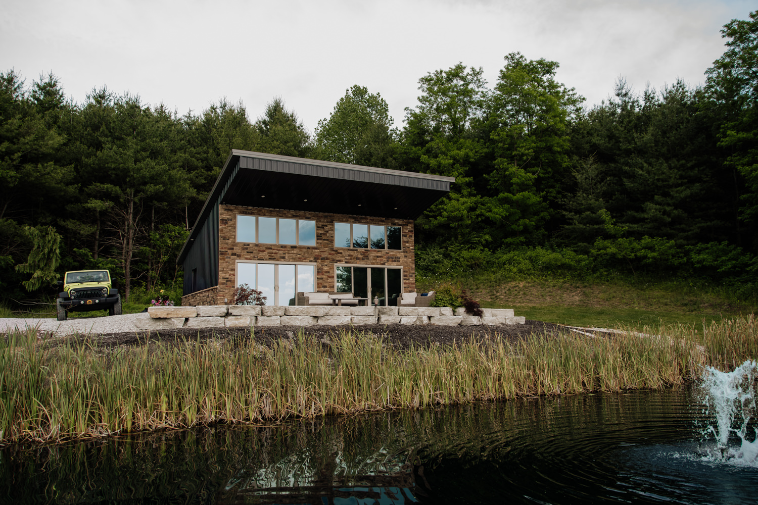 Wide shot of the modern luxury cabin The Blantons at Bourbon Ridge Retreat in Logan Ohio.