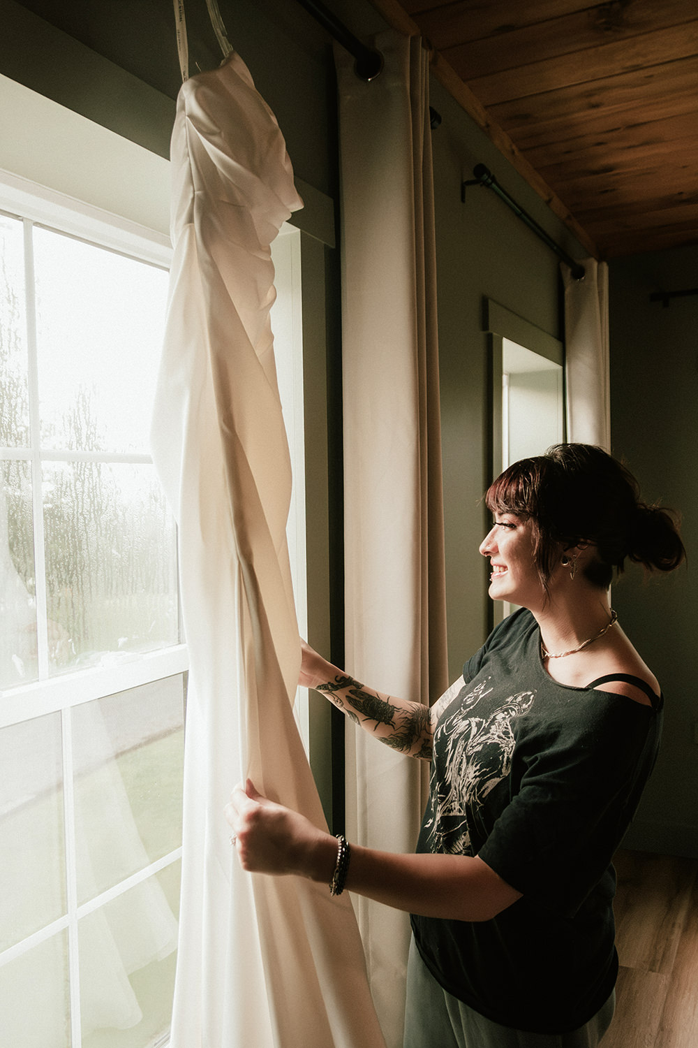 Close-up of bride near natural morning light in a cozy cabin.