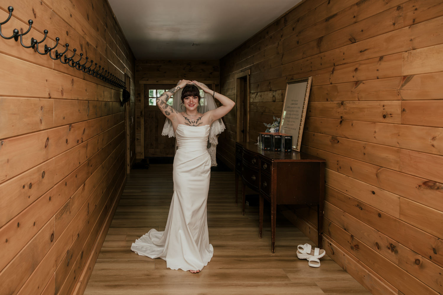 Bride adjusts her veil during her Hocking Hills cabin reception.