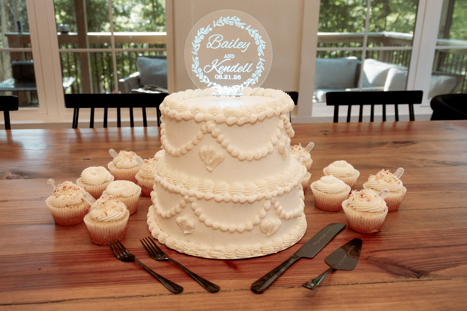 Intimate wedding cake resting on a wooden table setup.