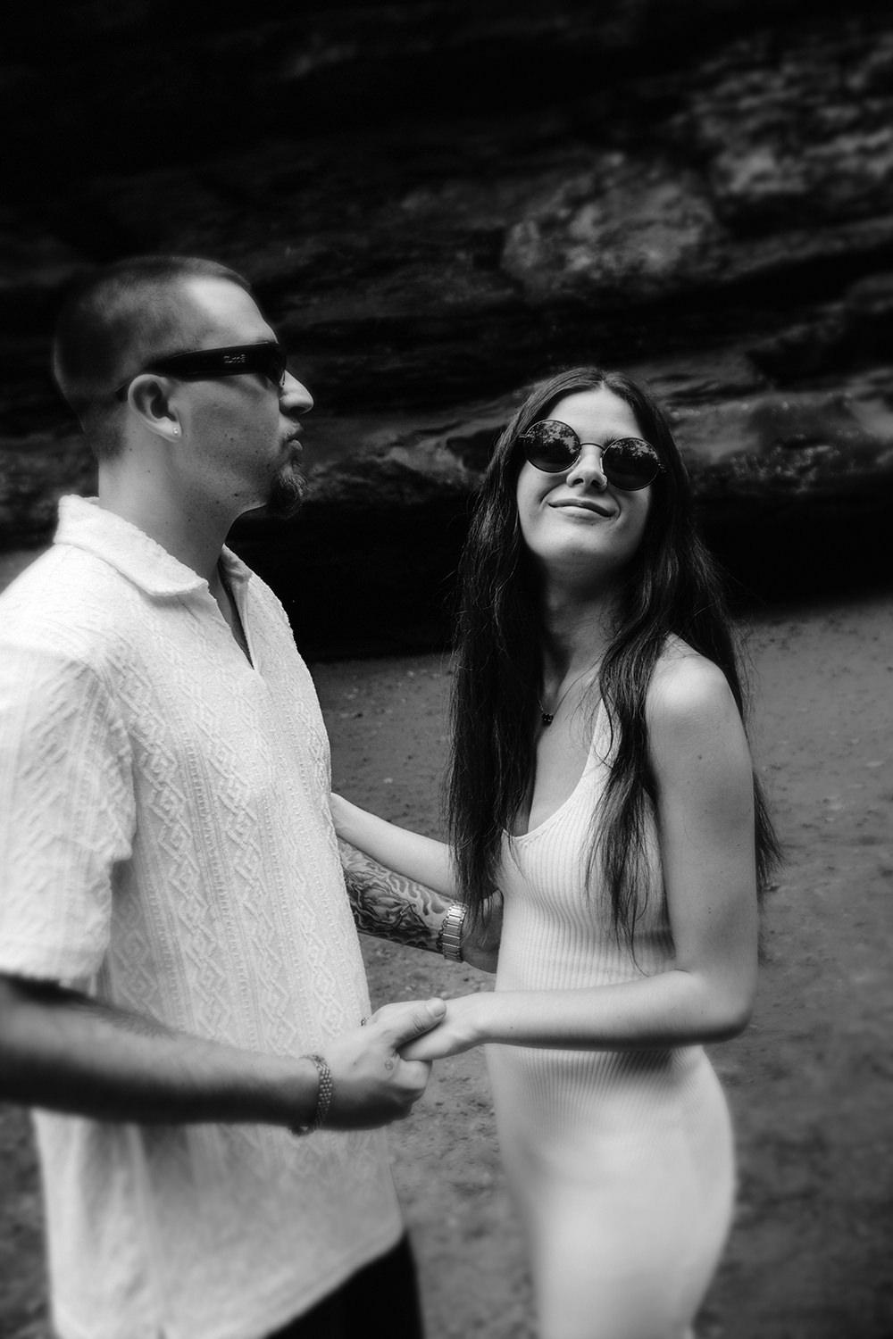 Alethia looking toward the camera with a warm smile as Anthony looks at her lovingly.