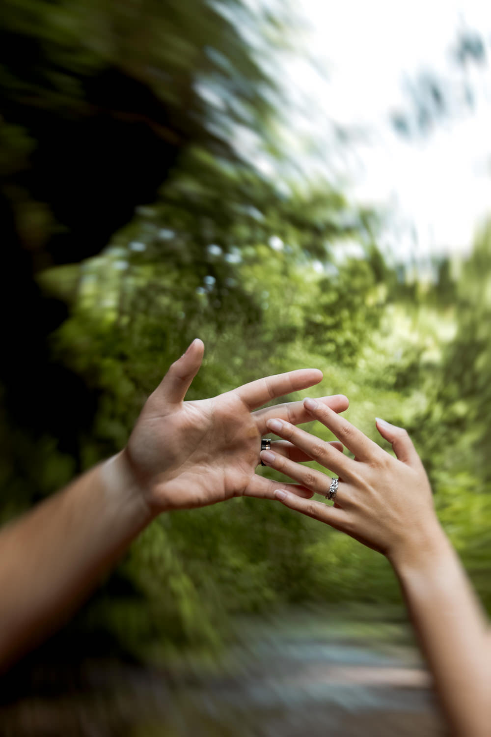 Artistic photo of hands brushing against each other.